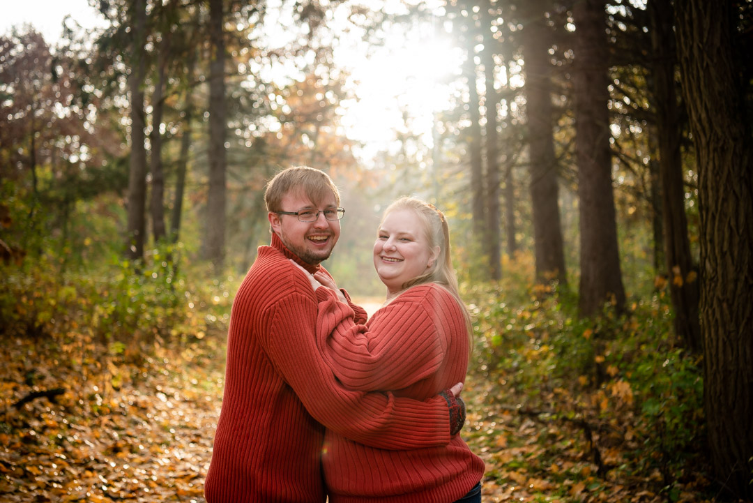 Nature-Engagement-Session-orange-sweaters-falling-leaves 2
