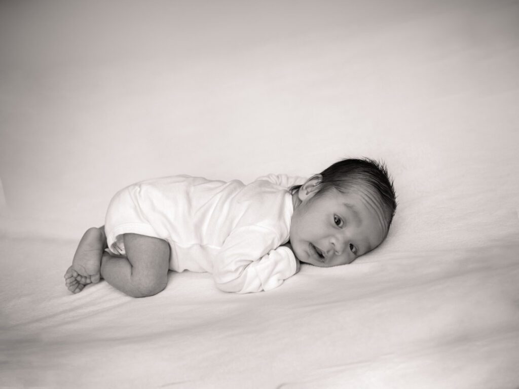 newborn-photo-session-in-home-white-onsie-fort-atkinson-wisconsin2